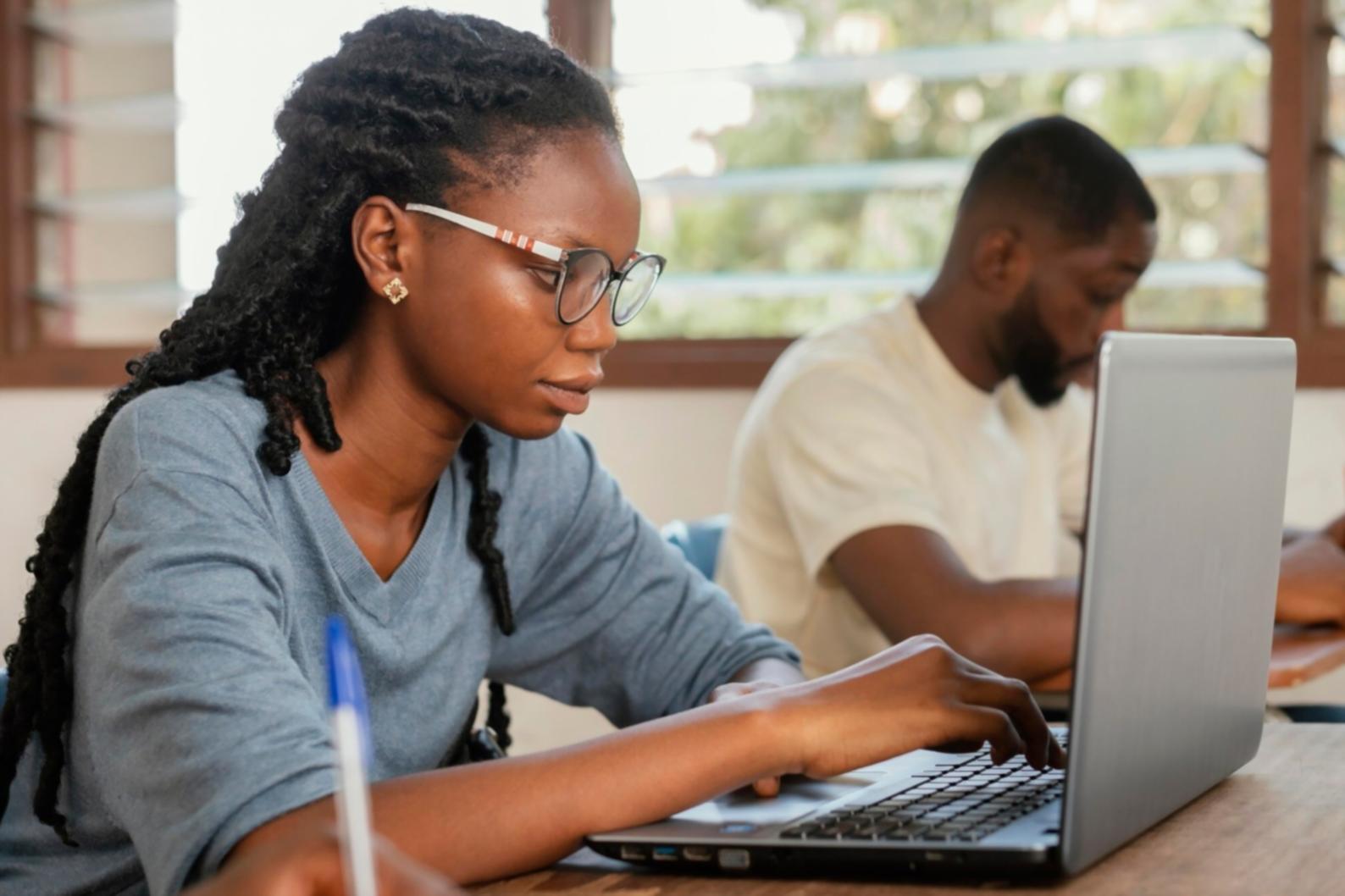 Students and educators collaborating in a modern financial analysis classroom setting